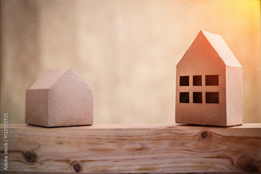 paper houses stands over a wooden background