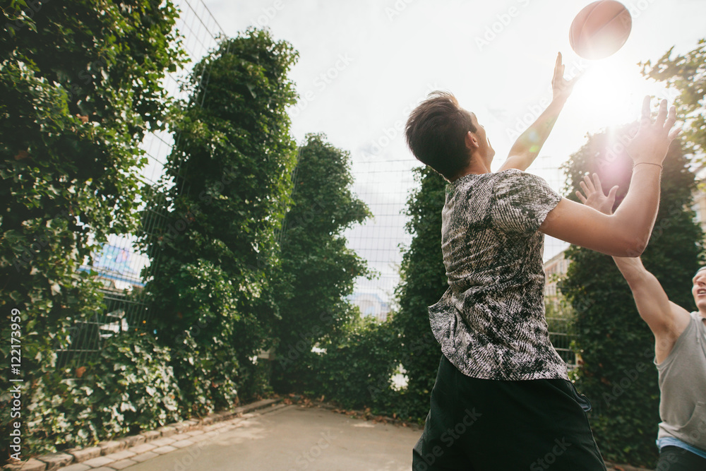 Friends playing basketball and having fun