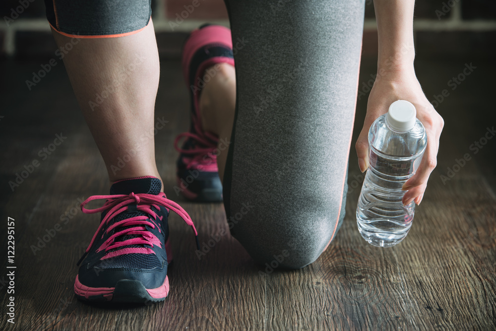 pick up bottle water after fitness exercise training, gym lifest