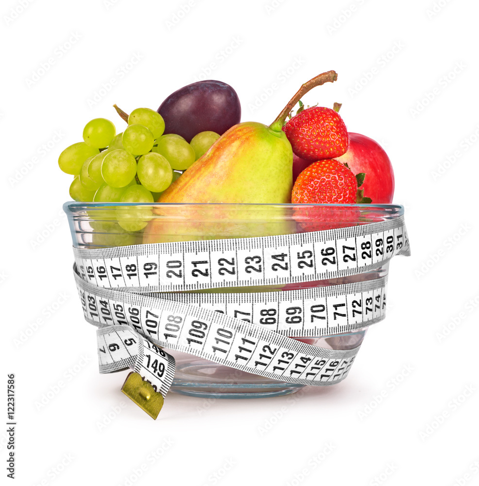 fruit in glass bowl with tape to measure