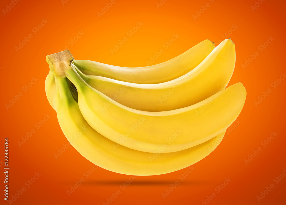 Bunch of bananas isolated on yellow background with clipping path