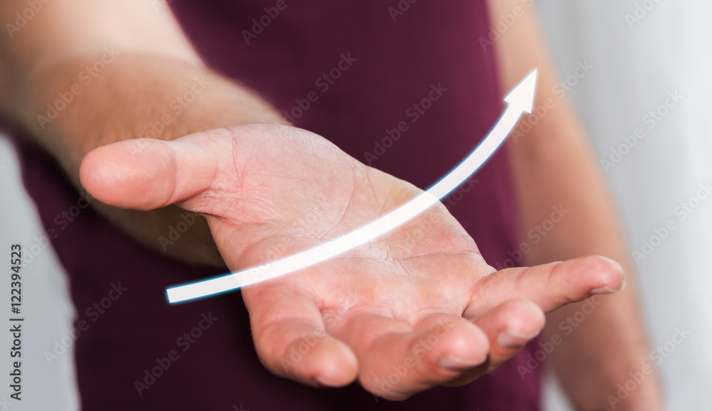 Businessman holding digital arrow ‘3D rendering’