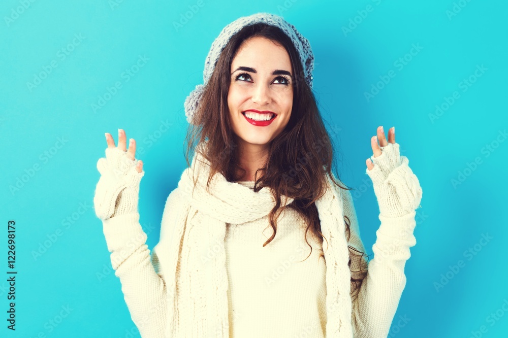 Happy young woman in winter clothes