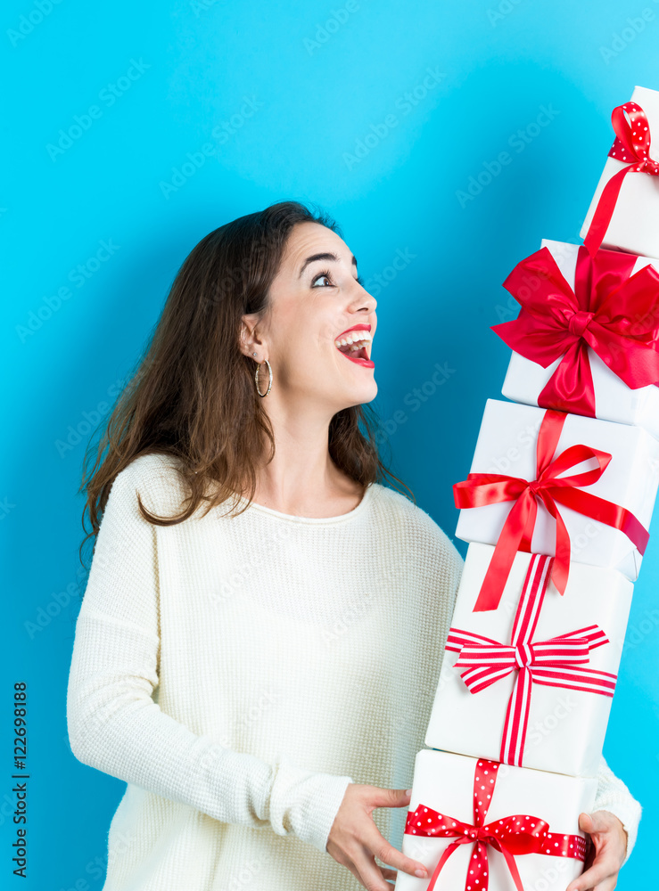 Woman holding a stack of gift boxes