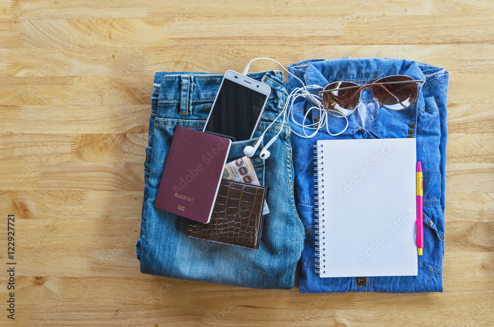 flatlay Travel accessories and costume on wooden floor