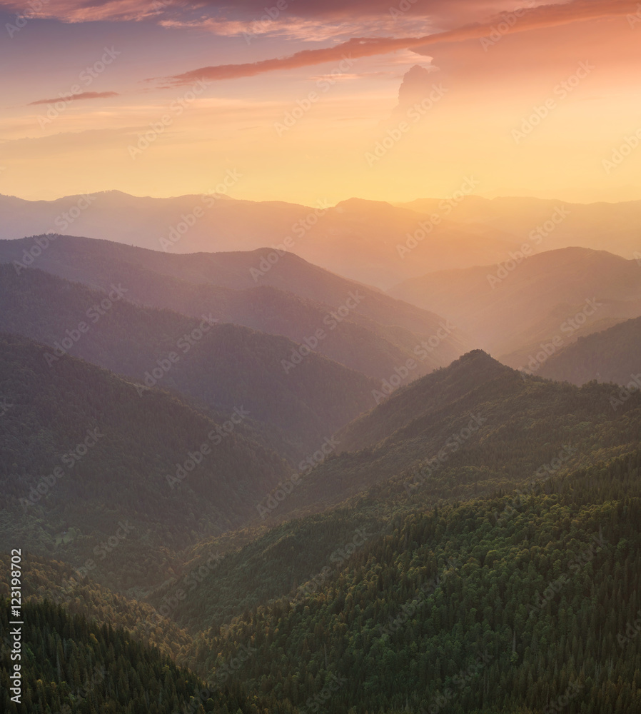 Hills lines in mountain valley during sunset. Natural summer mountain landscape..