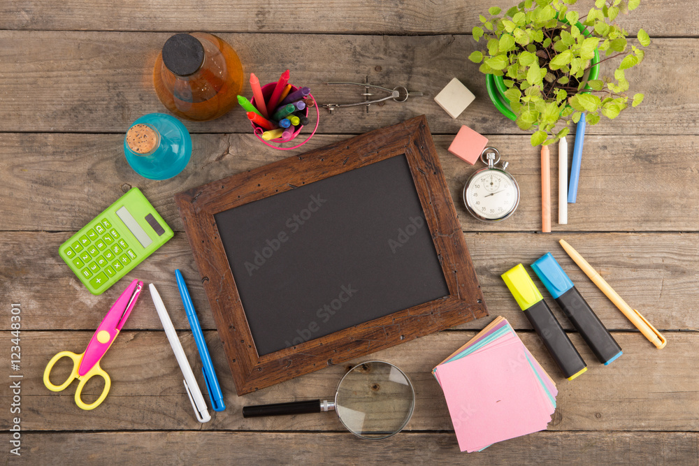 Back to school concept - school supplies on the wooden desk