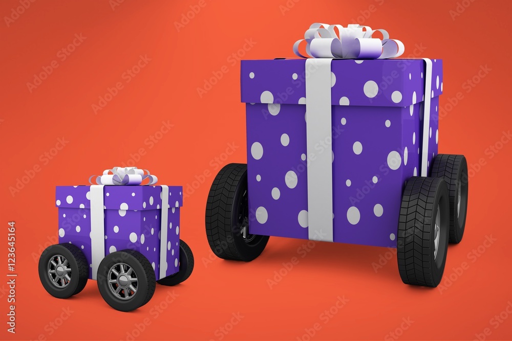 Composite image of gift box with gray ribbon on wheels 