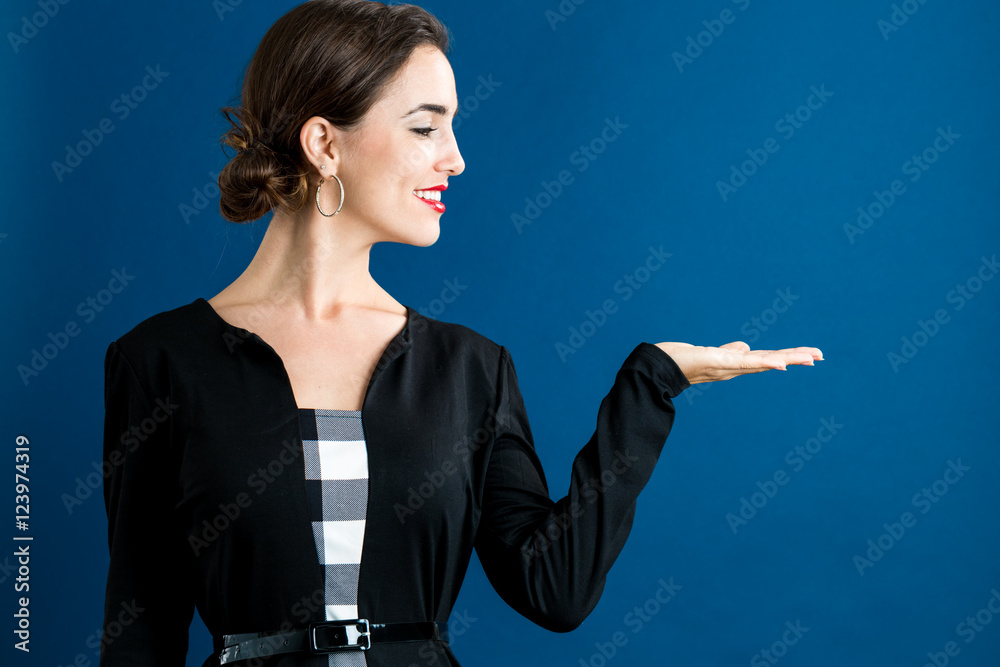 Young woman with a displaying hand gesture