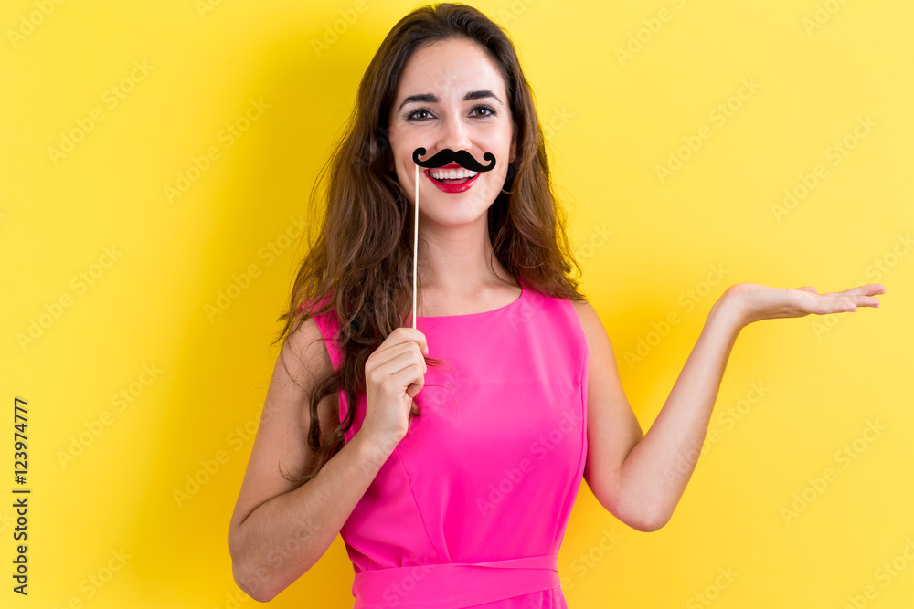 Young woman holding paper party sticks