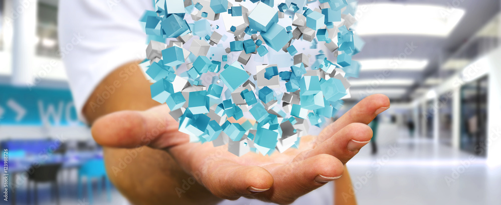 Businessman holding flying abstract sphere with shiny cube 3D re