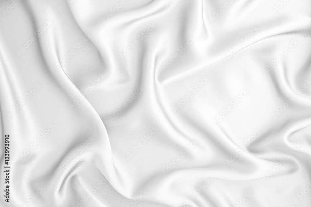 Close up wave  luxury white silk or satin fabric background