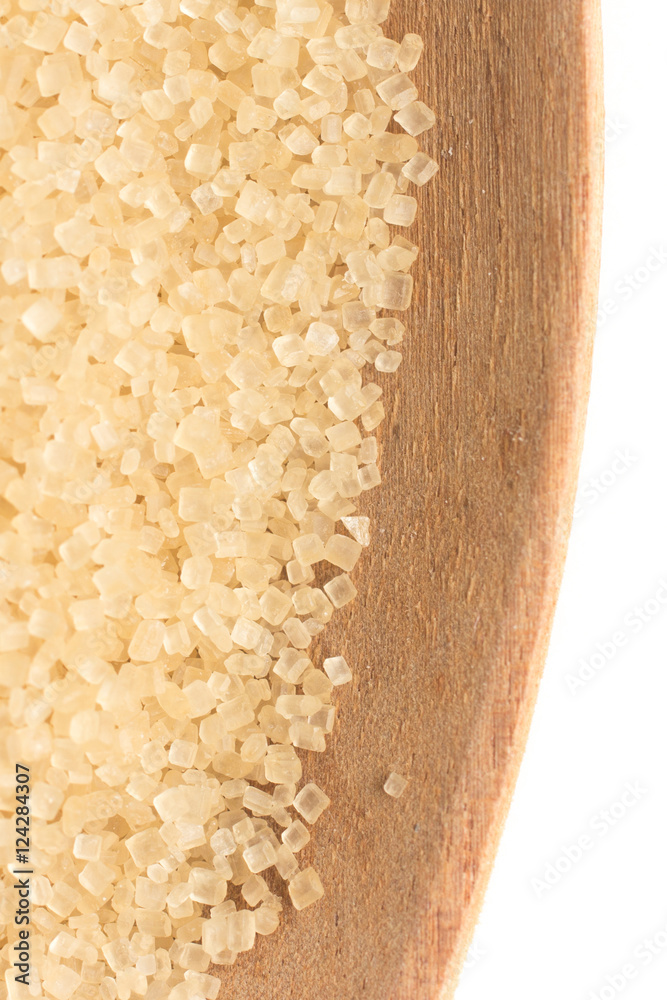 Demerara Sugar into a spoon