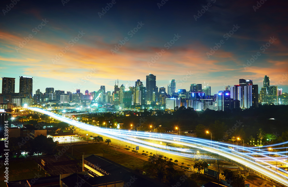 Abstract and car lighttrail  background, city skyline downtown background and highway interchanged n