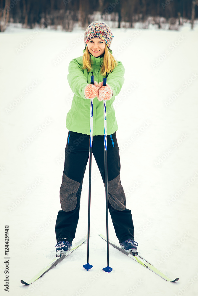 Young Woman with ski happy smiling face winter time snow Skiing Sport and healthy Lifestyle concept