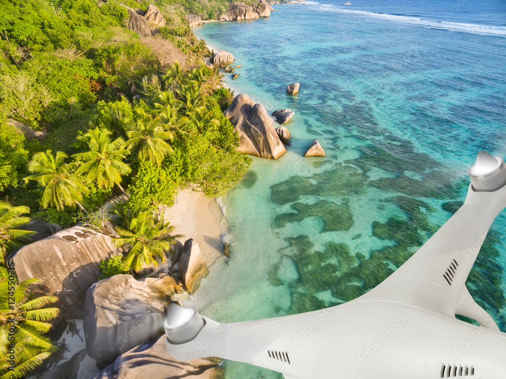 Drone flying above tropical beach