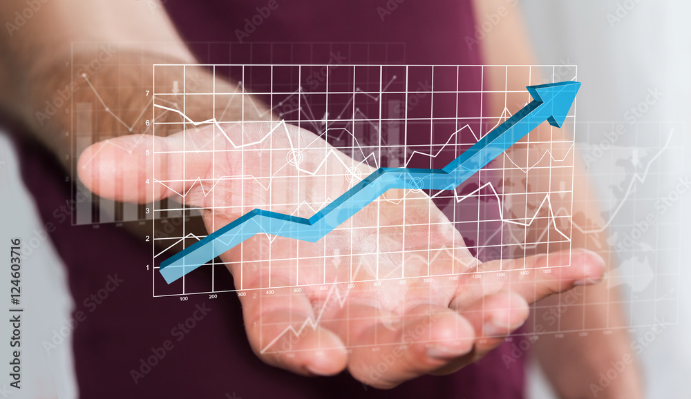 Businessman holding digital charts bars and blue arrow