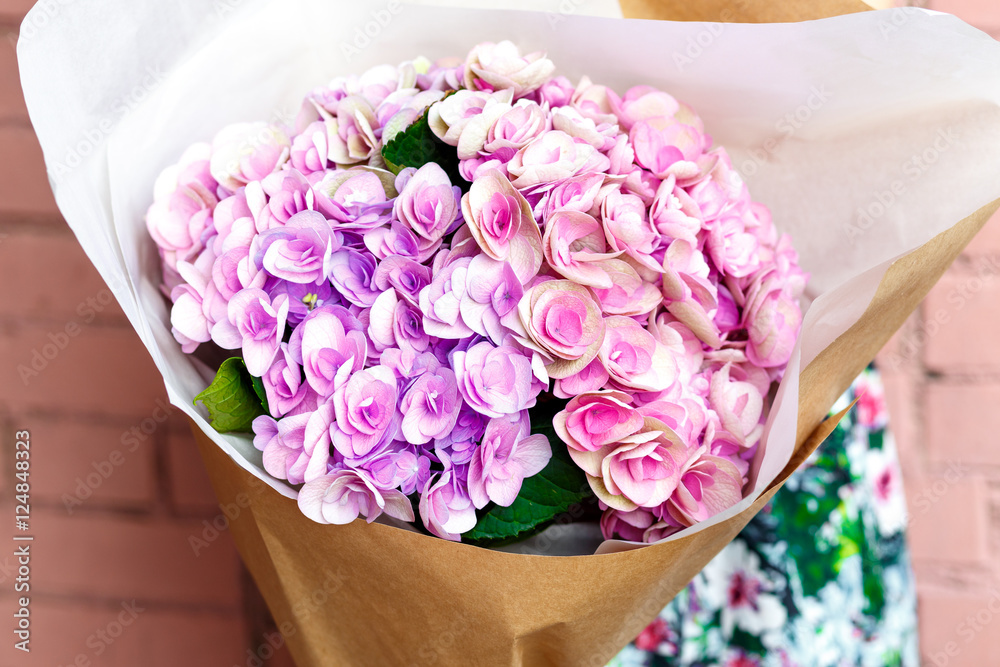 woman with bouquet of flowers in kraft paper