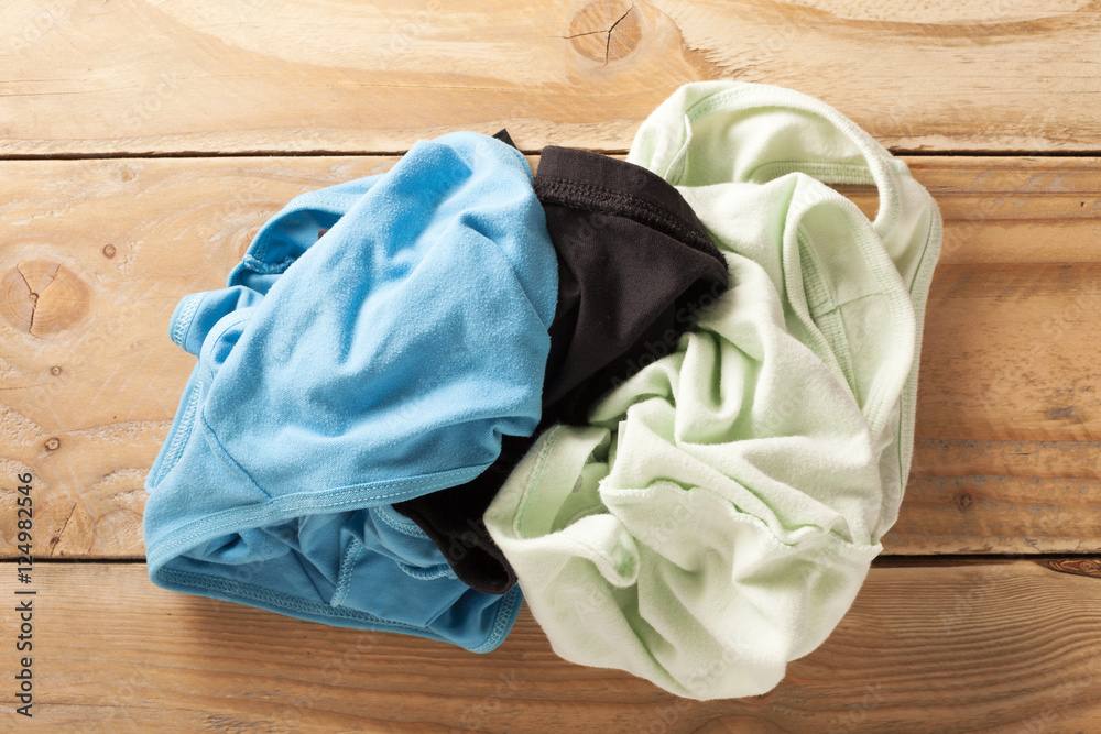 pile of dirty cloth on wood.