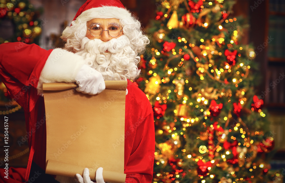 Christmas concept. Santa Claus and blank list