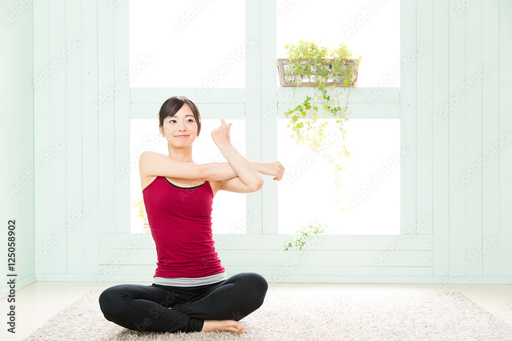 young asian woman exercising in the room