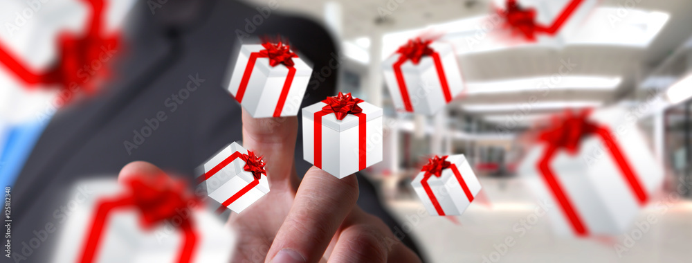 Man celebrating christmas holding gift in his hand