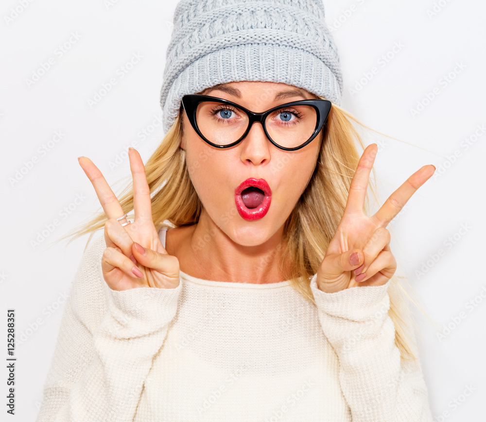 Young woman giving the peace sign