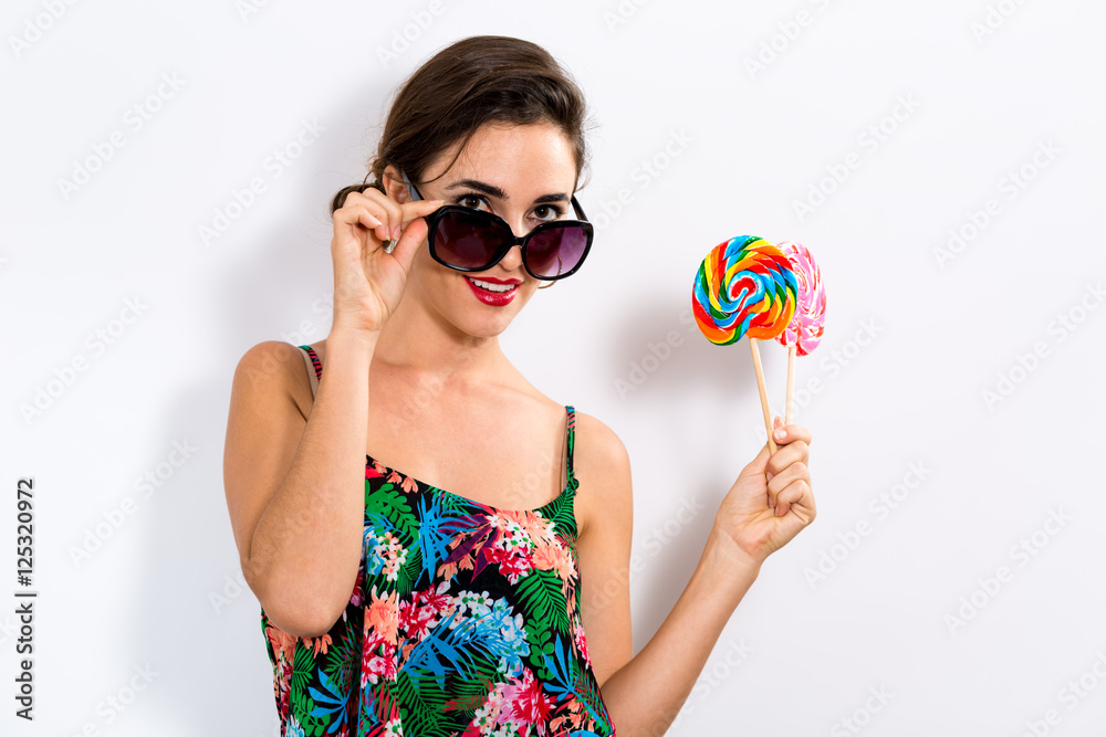 Young woman eating a lollipop