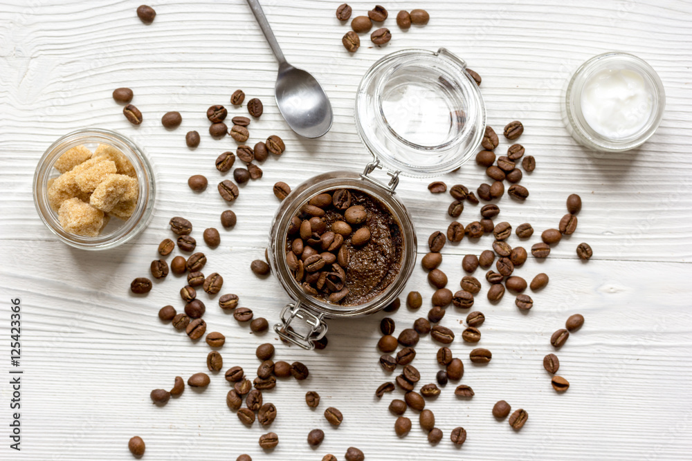 Body scrub of ground coffee top view on wooden table