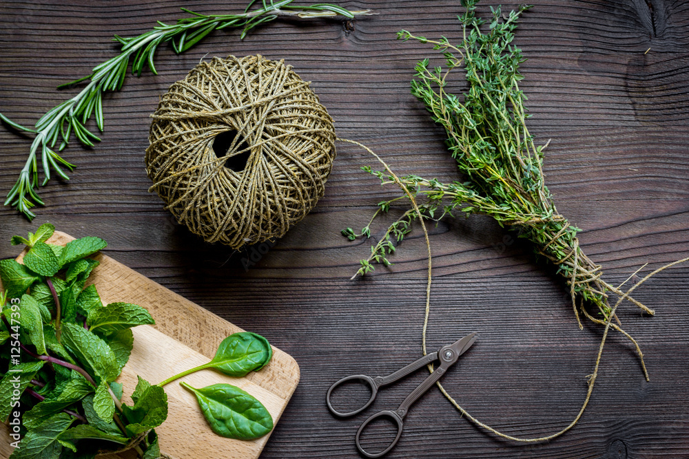 harvesting herbs for winter top view on wooden background