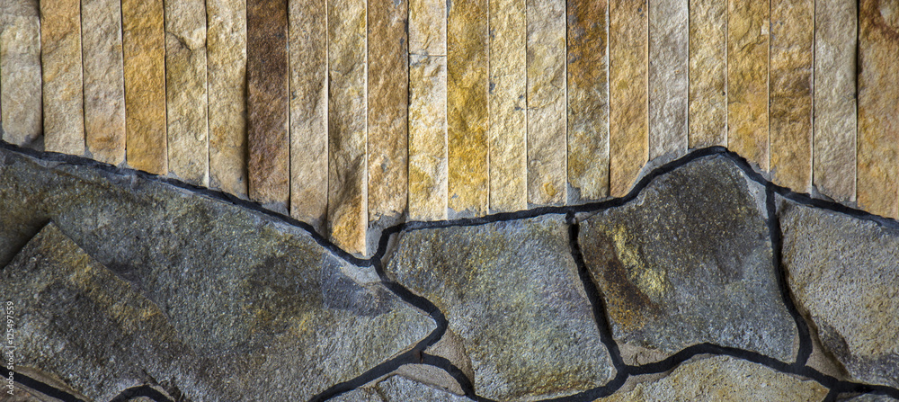 house wall decorated with a wild stone slate, sandstone