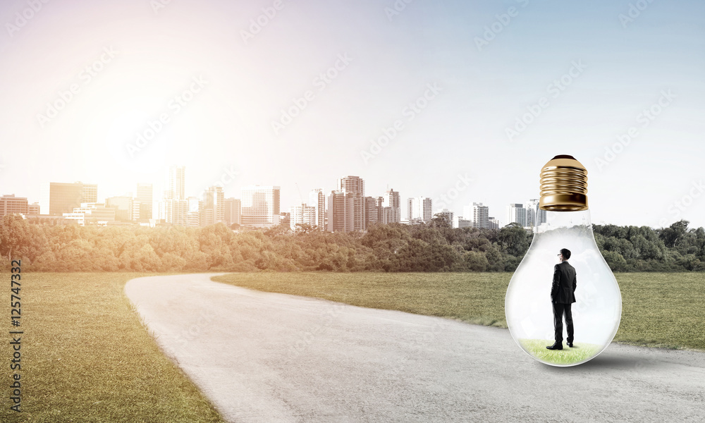 Businessman inside light bulb