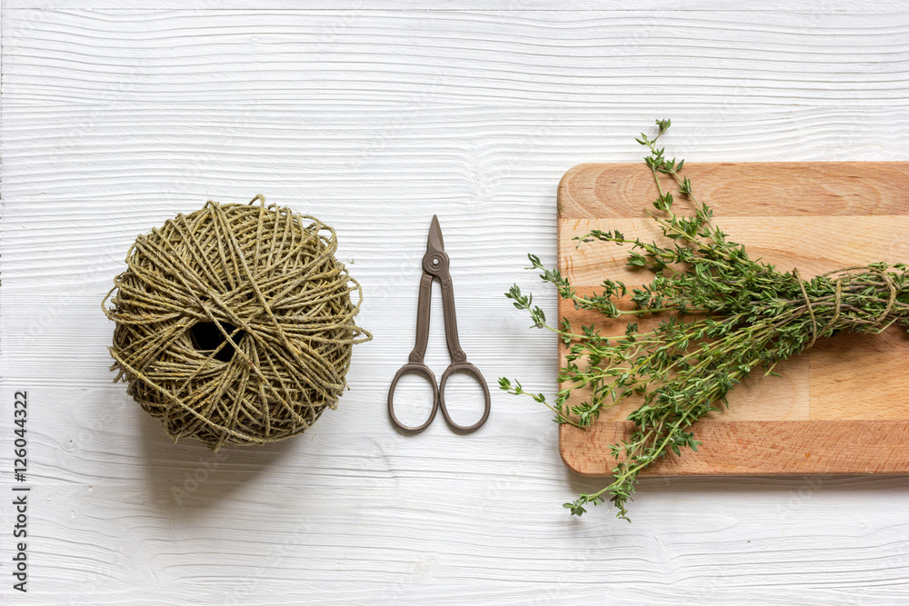 fresh herbs preparation to be dried top view wooden background