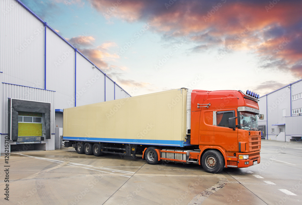 Truck in unloading in warehouse