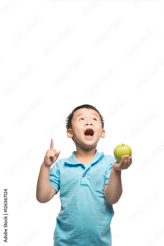 Asian baby boy holding and eating red apple, isolated on white