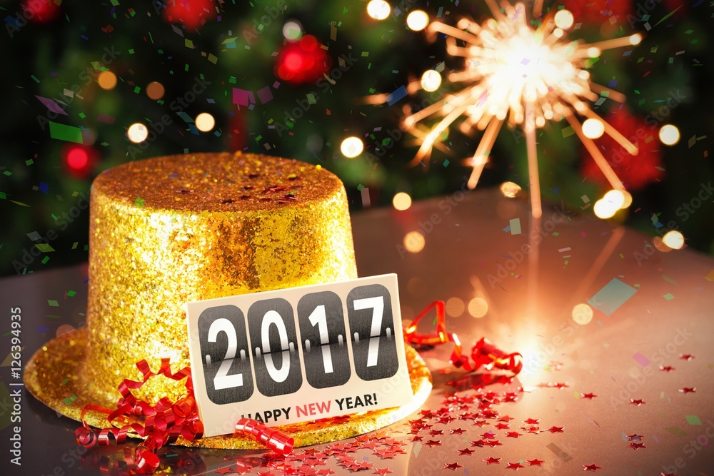  Digital composite of Happy new year card leaning on gold party hat