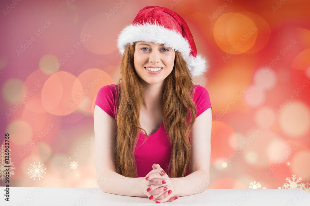 Portrait of beautiful woman in santa hat