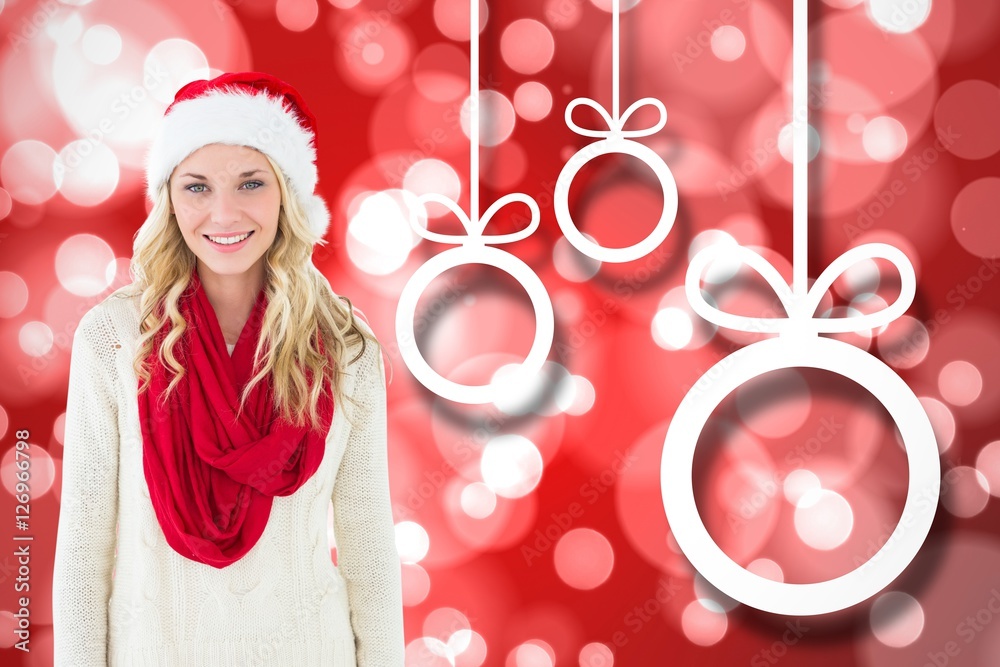 Beautiful woman in santa hat standing against digitally generate