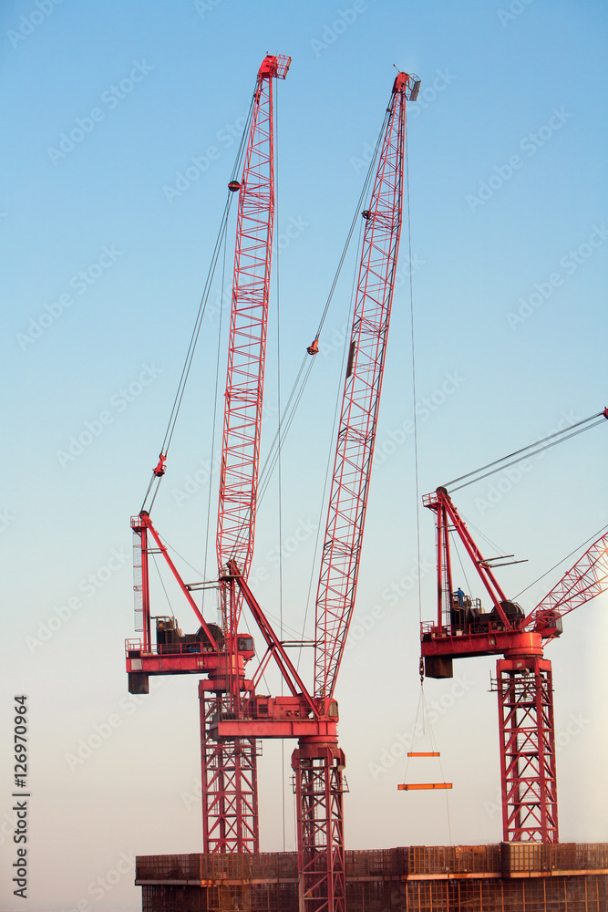 Construction Cranes against blue sky