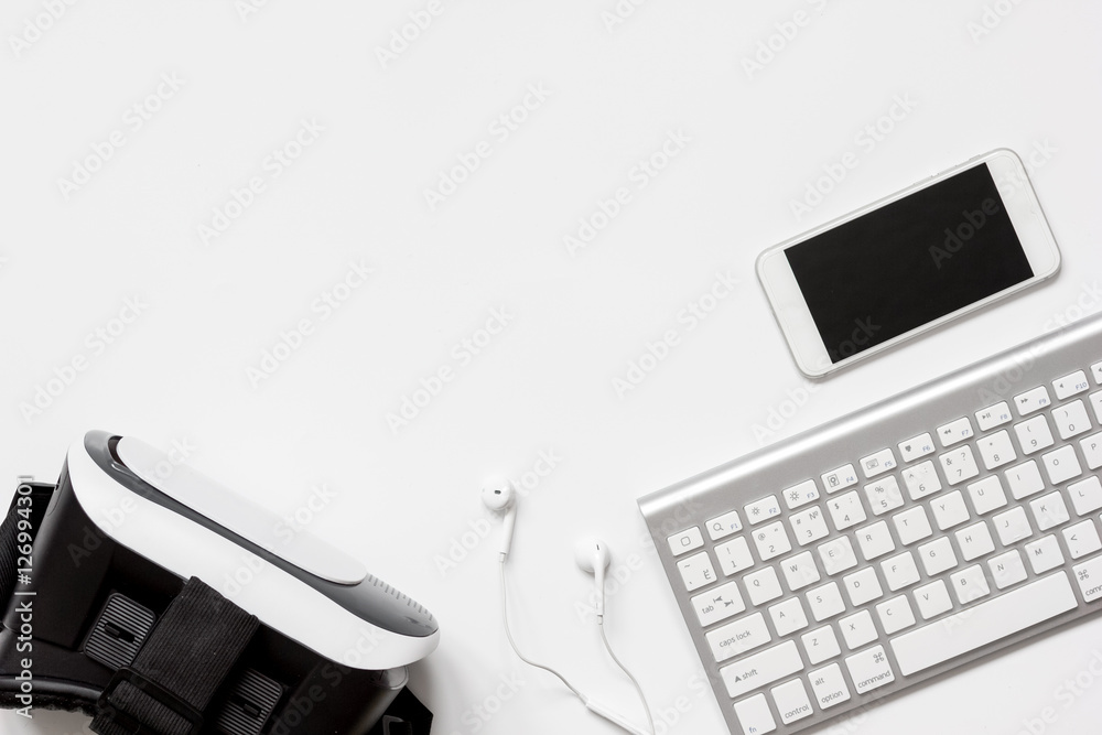 virtual reality glasses with smartphone, keyboard on white background