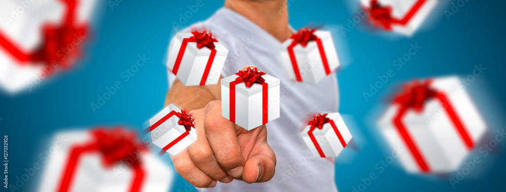 Man celebrating christmas holding gift in his hand