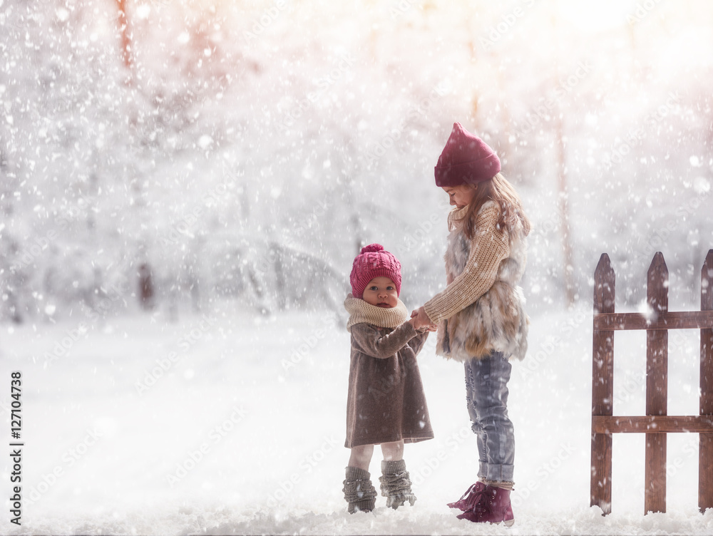 girls playing on a winter walk