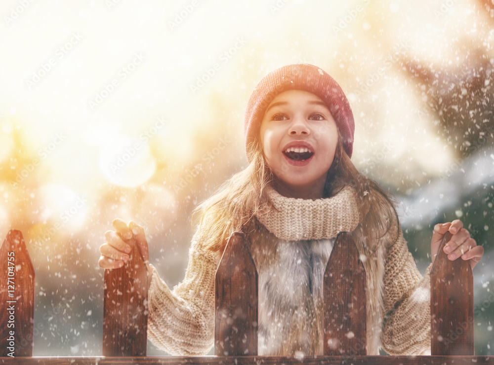 girl playing on a winter walk