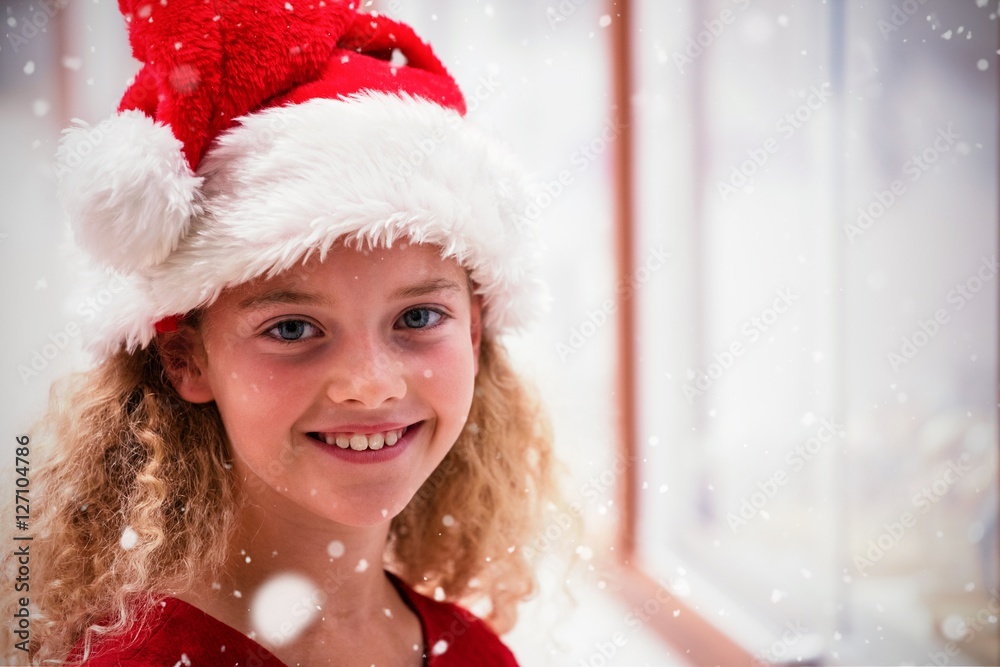 Composite image of portrait of girl in christmas attire