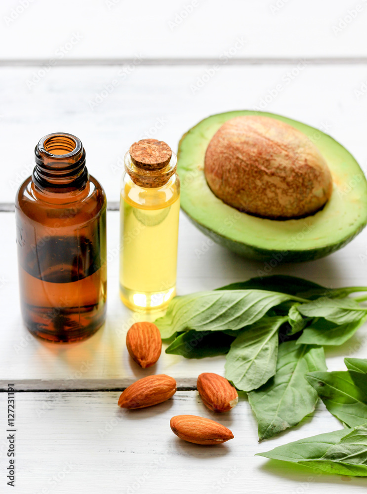 avocado oil for handmade cosmetics on wooden background