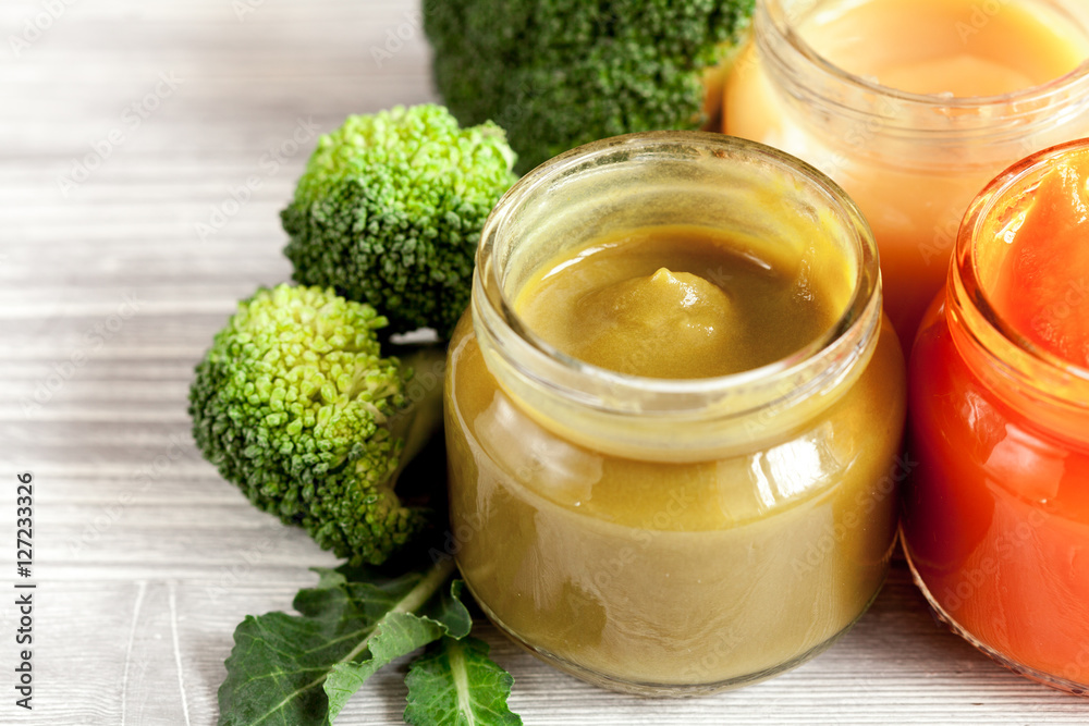 baby vegetable puree on wooden background