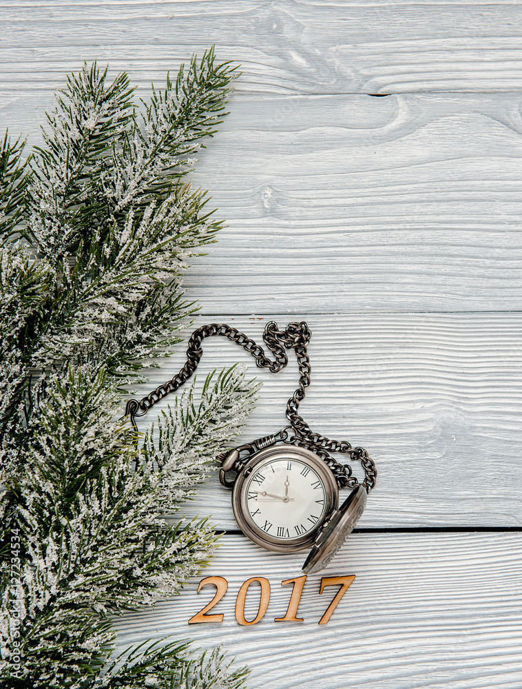 new year on wooden background with watch top view