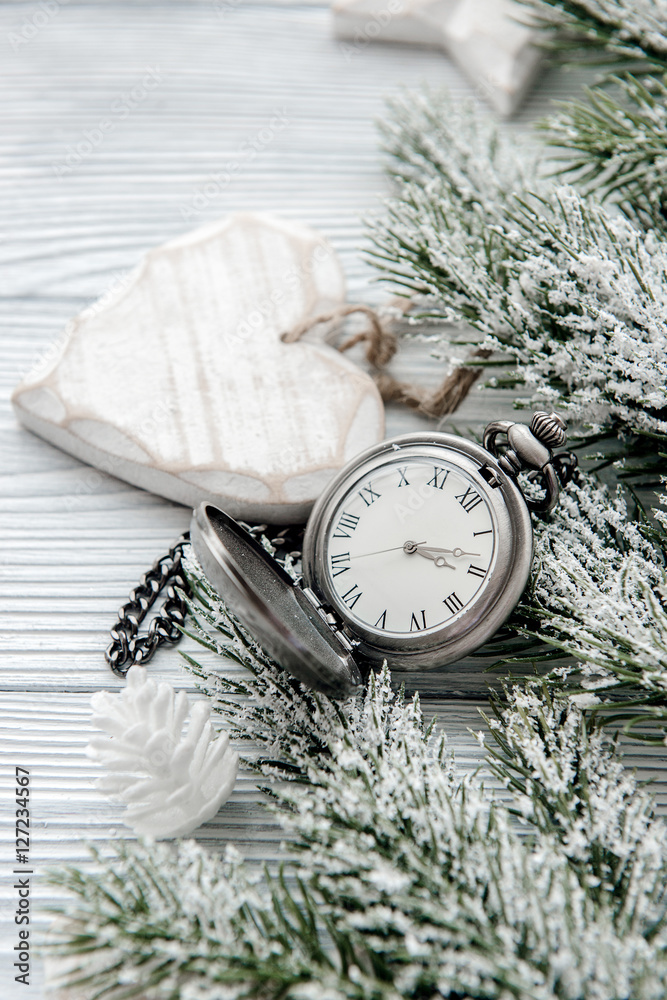 new year on wooden background with watch close up