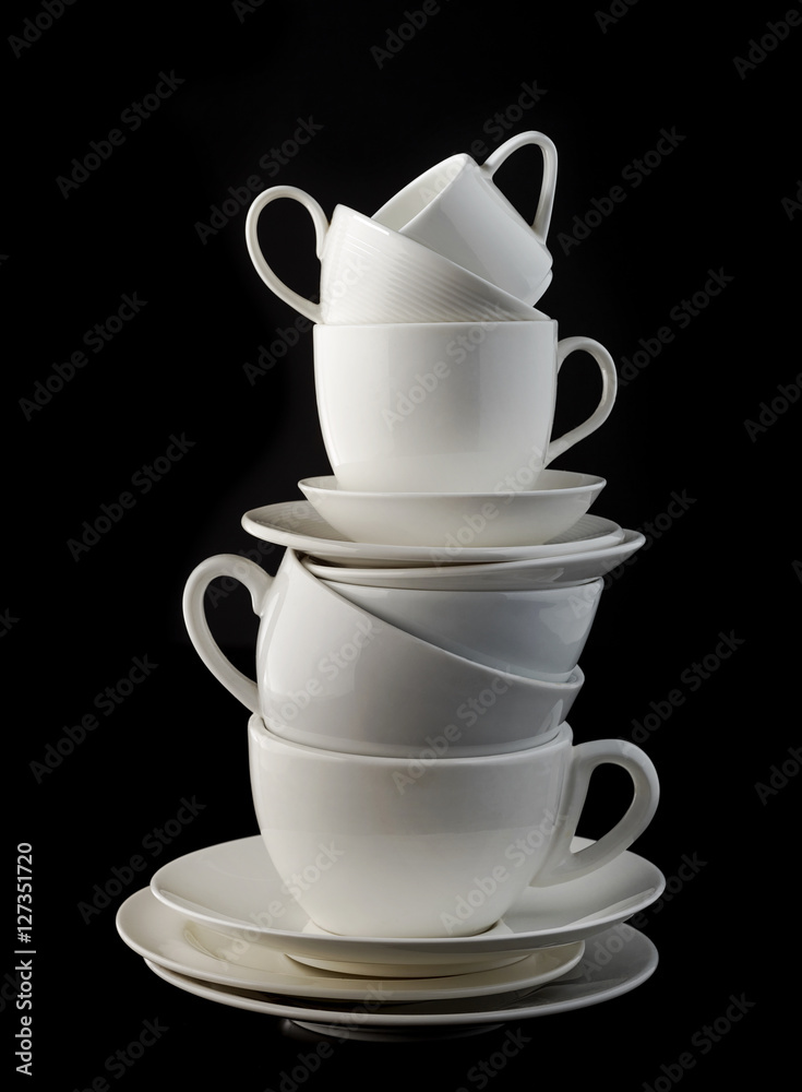 stack of white coffee cups and plates