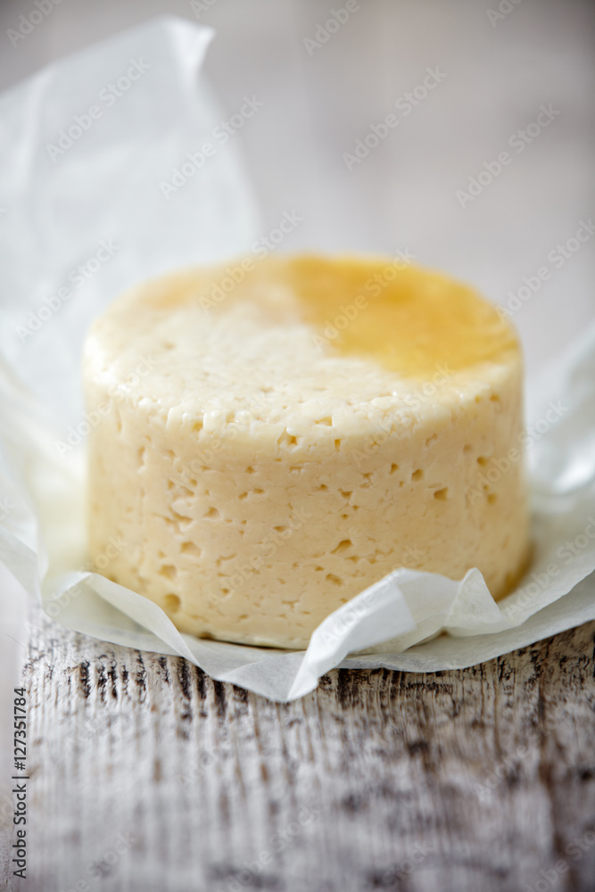 fresh cheese on wooden table